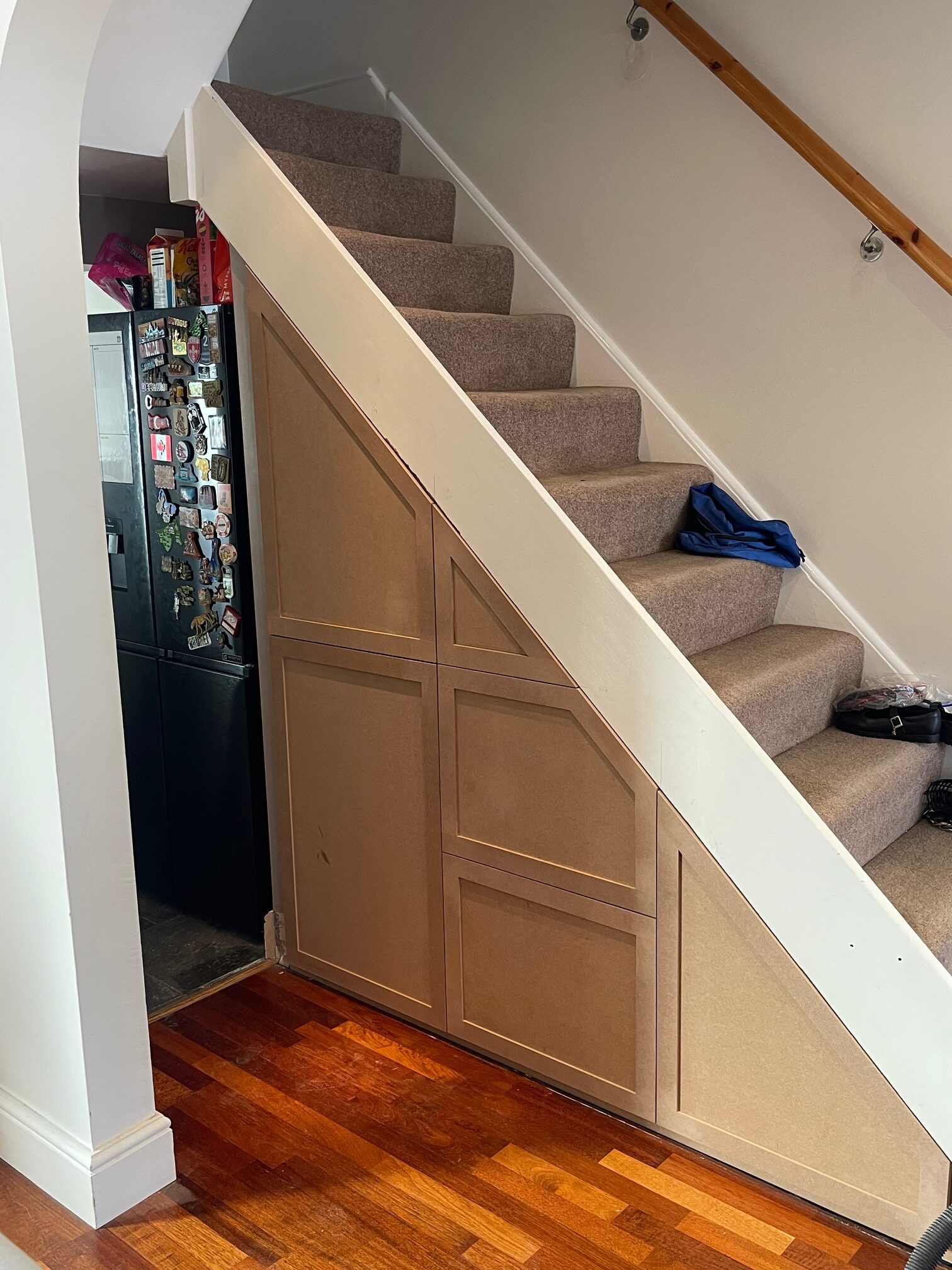 understairs storage with shaker style doors and draws